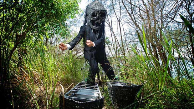 At the coalface: Alison Clouston's huge shoes and mask, part of a project protesting a coalmine threatening a nature reserve.