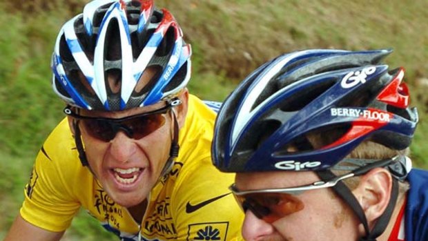 Lance Armstrong and Floyd Landis riding together at team Discovery Channel in 2004.