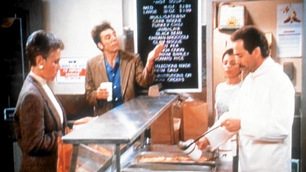 A still from a Seinfeld episode featuring the "Soup Nazi" (right).