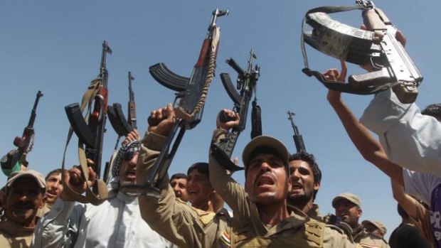 Call to arms:  Shiite volunteers take up arms provided by the government to fight the ISIL insurgency.