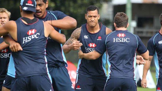 Potential: Israel Folau (second from right) trains with the Waratahs at Moore Park, leading up to their match against the Hurricanes on Saturday.