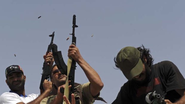 Big shots ... Libyan rebel soldiers celebrate with gunfire.