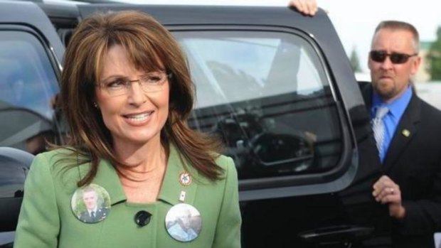 Agent David Chaney behind Sarah Palin in a photo from Facebook.