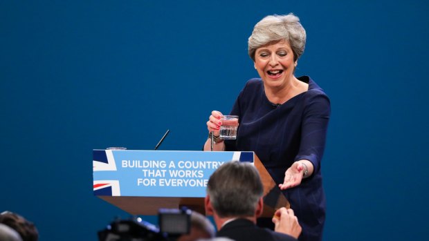 Prime Minister Theresa May was handed a cough sweet in a failed attempt to stop her cough during a speech at her party's conference on Wednesday.