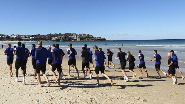 Picture postcard: Manchester United had a very public recovery session in Bondi on Sunday.