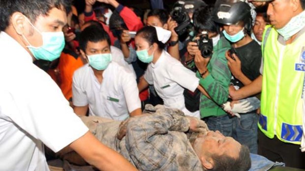 Indonesian medical team tend a victim of Merapi volcano.