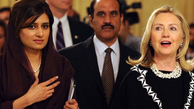 US Secretary of State Hillary Clinton arrives with Pakistan's Foreign Minister Hina Rabbani Khar for a joint press conference afer their talks at the Pakistani Foreign Ministry.