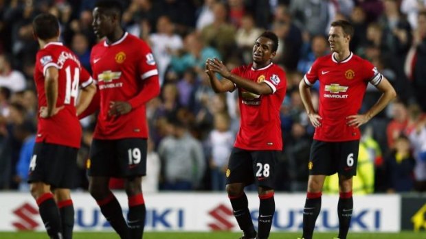 Another bad day at the office: United players react after their side conceded a second goal.
