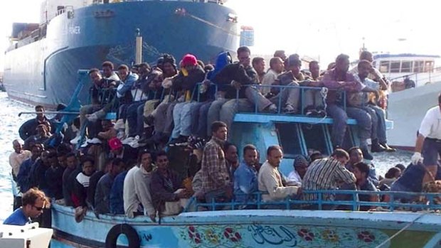 Egyptian exodus ... a boat believed to be carrying Egyptians arrives in southern Italy, adding to the thousands of Tunisians fleeing turmoil in their country.