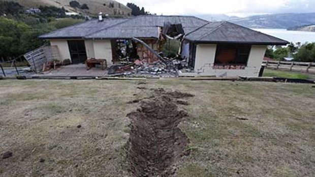 A giant boulder  crashed through a house during Tuesday's earthquake near Lyttelton, on the outskirts of Christchurch.
