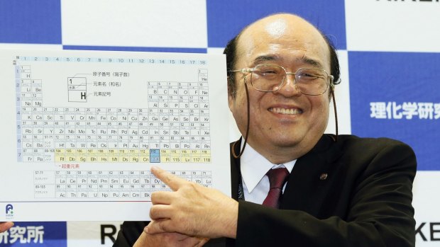 Kosuke Morita of Riken Nishina Center for Accelerator-Based Science points out the new elements added to the periodic table of the elements during a press conference.