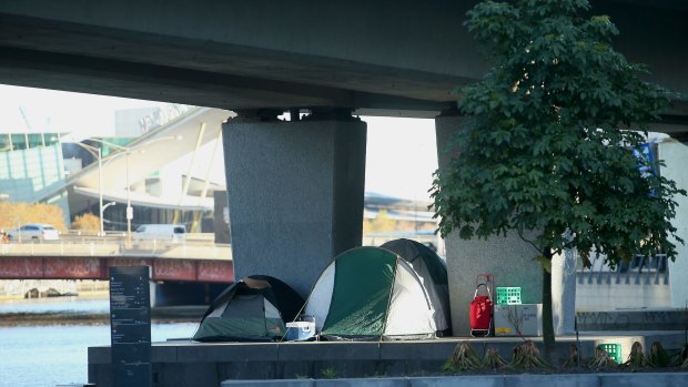 Tents erected underneath a railway overpass near the Yarra River at Enterprize Park.