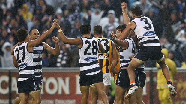 Comeback triumph .... Geelong celebrates another narrow win over Hawthorn.