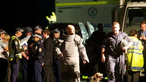 Siege site ... members of the bomb squad gathered in Burrawong Avenue, Mosman, where Madeleine Pulver was trapped.