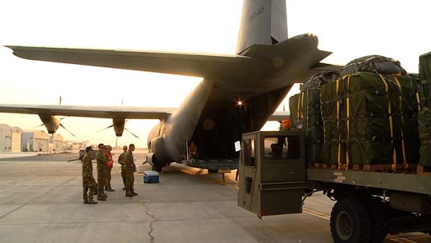 Support: Australian troops load supplies for trapped Iraqis.