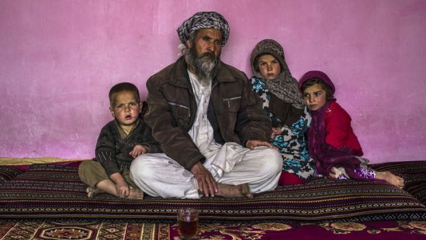 Mohammad Zaman, the father of Zakia, with his other children at their home.