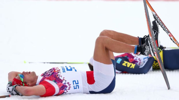 Chris Andre Jespersen of Norway rests on the snow.