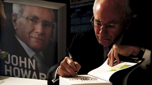 Overstayed ... John Howard signs copies of his book in Sydney yesterday.