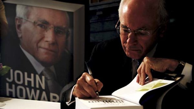 Overstayed ... John Howard signs copies of his book in Sydney yesterday.