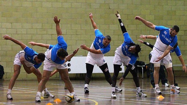 Back to school ... yesterday's rain forced the Springboks to take shelter in the salubrious surroundings of the sports hall at Sydney Boys High.