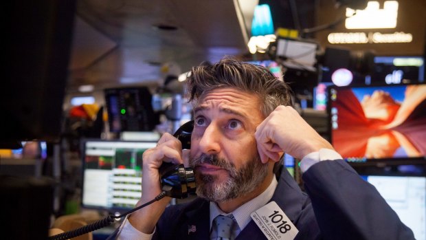 A trader on the floor of the New York Stock Exchange on Friday. US stocks fluctuated in whipsaw trading.