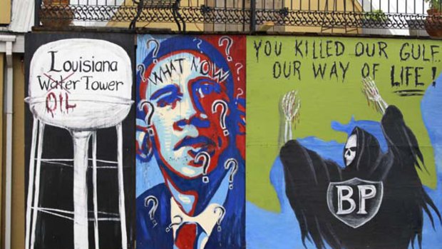 A wall painted with protests messages against British Petroleum (BP) and US President Barack Obama is pictured as Obama's motorcade travels from New Orleans to Grand Isle, Louisiana.