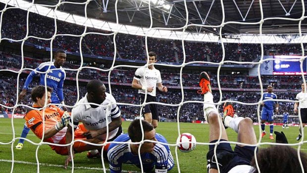 Ghost goal ... players watch as Juan Mata's shot bounces near the goaline. The goal was controversially awarded to Chelsea.