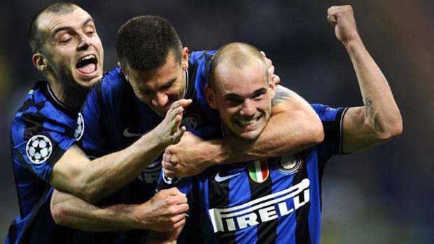 Happy days . . . from left, Goran Pandev, Thiago Motta and Wesley Sneijder celebrate Diego Milito's goal for Inter.