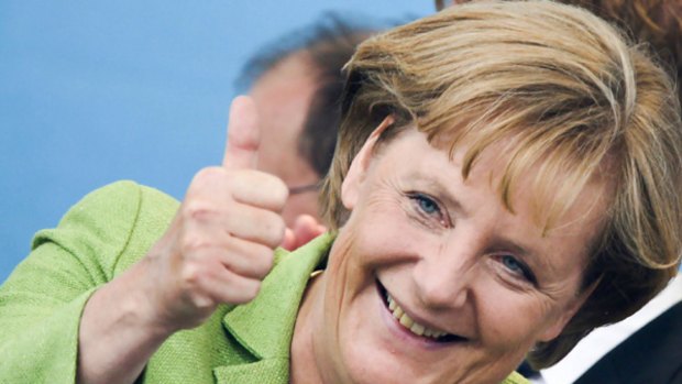 Angela Merkel gives a thumbs up at a election rally in Dresden.