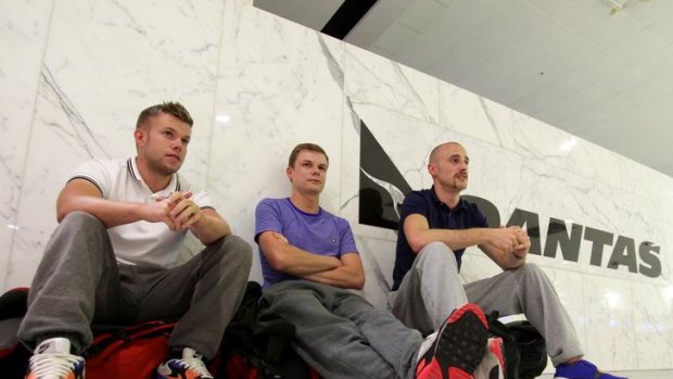 Stranded Qantas passengers, from left, Kev Crulley, Chris Crulley and Joe Moore at Sydney International Airport.