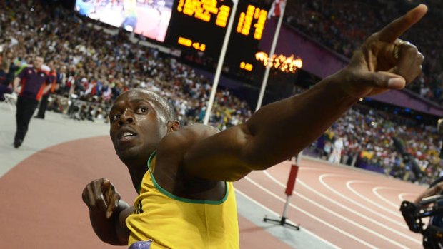 Trademark celebration ... Jamaica's Usain Bolt after winning the men's 100m final.
