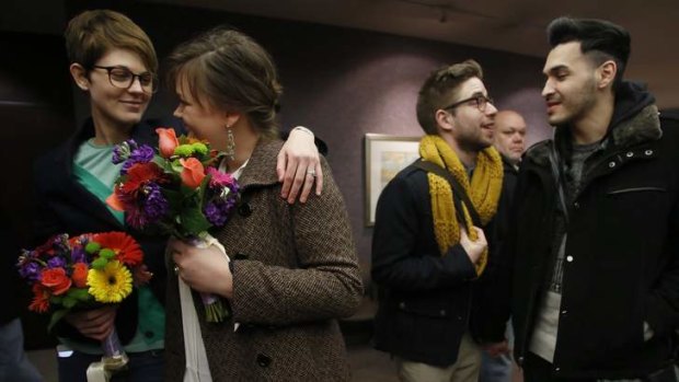 Natalie Dicou and her partner Nicole Christensen, and James Goodman and his partner Jeffrey Gomez, wait to get married in Salt Lake City on December 20.