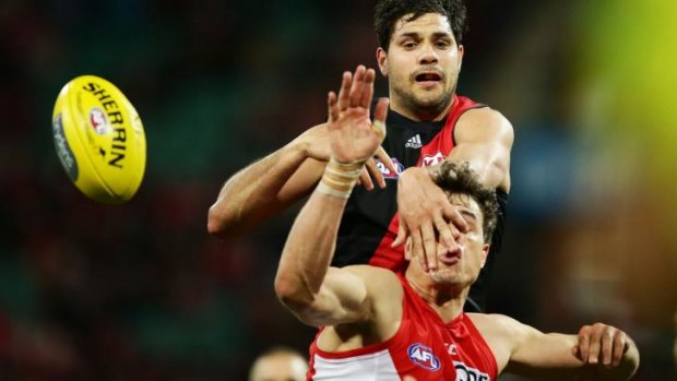 Uneasy Ryder: Mike Pyke  gets a poke in the eye as Bomber Patrick Ryder attempts the spoil.