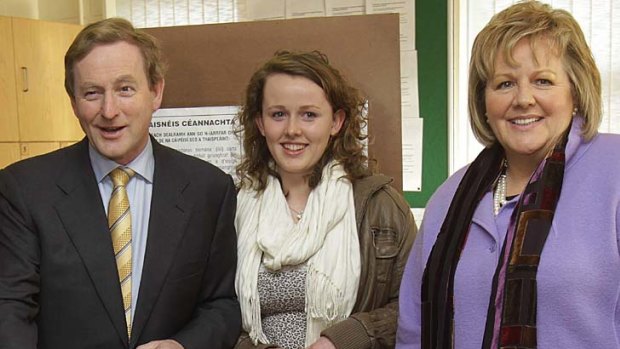 Ireland's Fine Gael leader Enda Kenny, accompanied by his wife Fionnuala and daughter Aoibhinn, casts his vote at a school in Castlebar, Ireland.