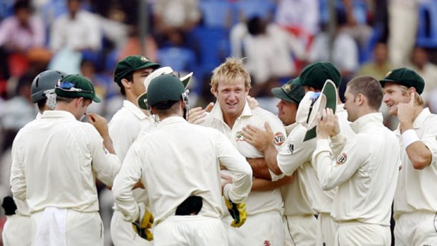 Prized scalp . . . Cameron White celebrates with his Australian teammates after taking the wicket of Indian star Sachin Tendulkar in Bangalore last year.