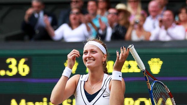 Petra Kvitova of the Czech Republic is overcome with joy after defeating Maria Sharapova to win the women's title.