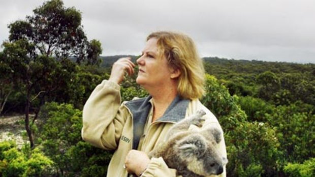 Tassin Barnard  looks over the area of her Australia Walkabout Wildlife Park that she says is under threat from a sand mine.