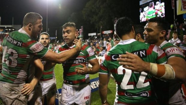 Sam Burgess congratulates Nathan Merritt after the winger scored his 145th try in South Sydney colours, breaking Benny Wearing's club record.
