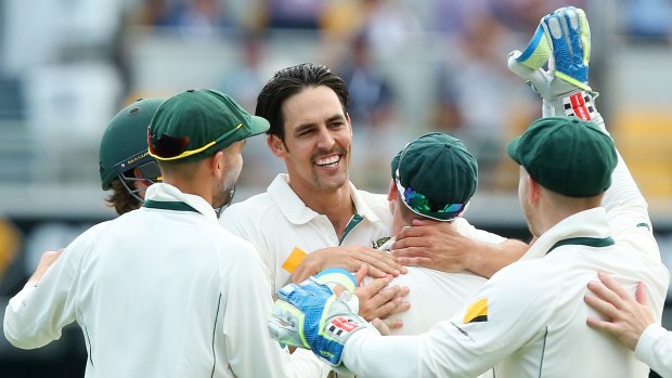 Mitchell Johnson celebrates the wicket of Ross Taylor. 