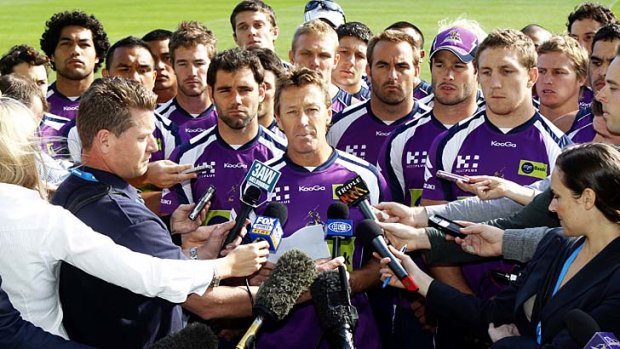 24 April 2010. Surrounded by all 22 players, Melbourne Storm coach Craig Bellamy reads a statement to the media regarding the future of the club in light of the penalties handed out by the NRL for systematic cheating of the salary cap.