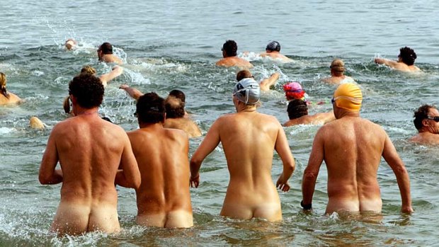 Cheeky dip: Swimmers set out on the Sydney Skinny, the world's first nude ocean swim, last year.