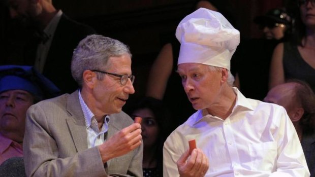Bon appetit: Nobel Laureates Eric Maskin (left) and Richard Roberts sample the dirty diaper sausage.