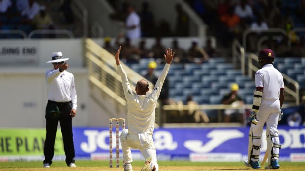 Lyon rampant: Australia's Nathan Lyon successfully appeals for leg-before against West Indies' Darren Bravo on day two of the second Test at Sabina Park, Jamaica.