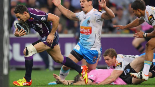Wrong man ... Billy Slater of the Storm runs in for a try as the referee is tackled.