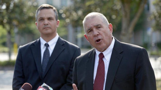Hal Uhrig, right, and Craig Sonner, former lawyers for George Zimmerman, speak to reporters.