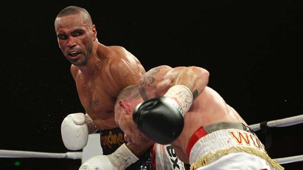 Take that ... Anthony Mundine connects with nemesis Garth Woods.