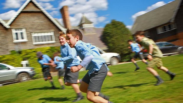 Rough and tumble ... boys are encouraged to learn through physical play at Tudor House.