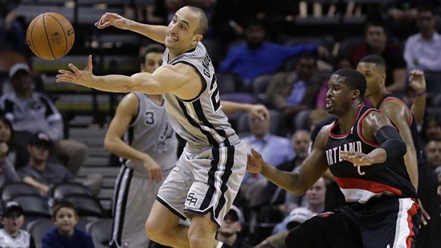 San Antonio Spurs' Manu Ginobili (20) and Portland Trail Blazers' Wesley Matthews (2) chase a loose ball during the second half.