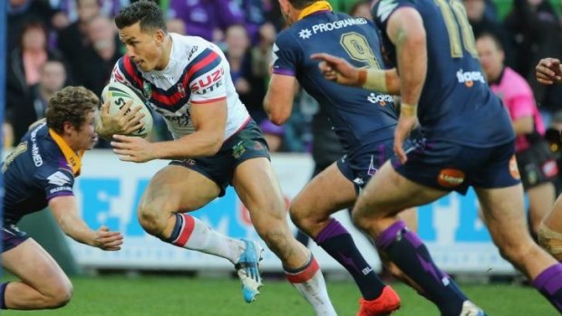 Sonny Bill Williams splits the Melbourne defence to score for the Roosters.