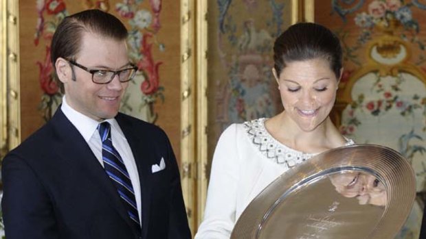 Overcame the king's opposition ? Daniel Westling and Crown Princess Victoria receive a gift before their wedding next Saturday.